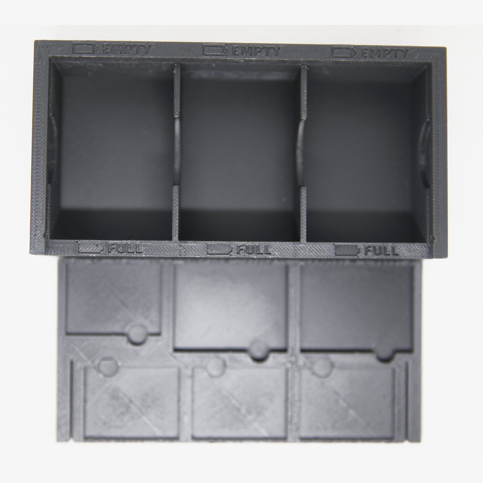 Battery Box open: three battery pockets and card pockets in the lid